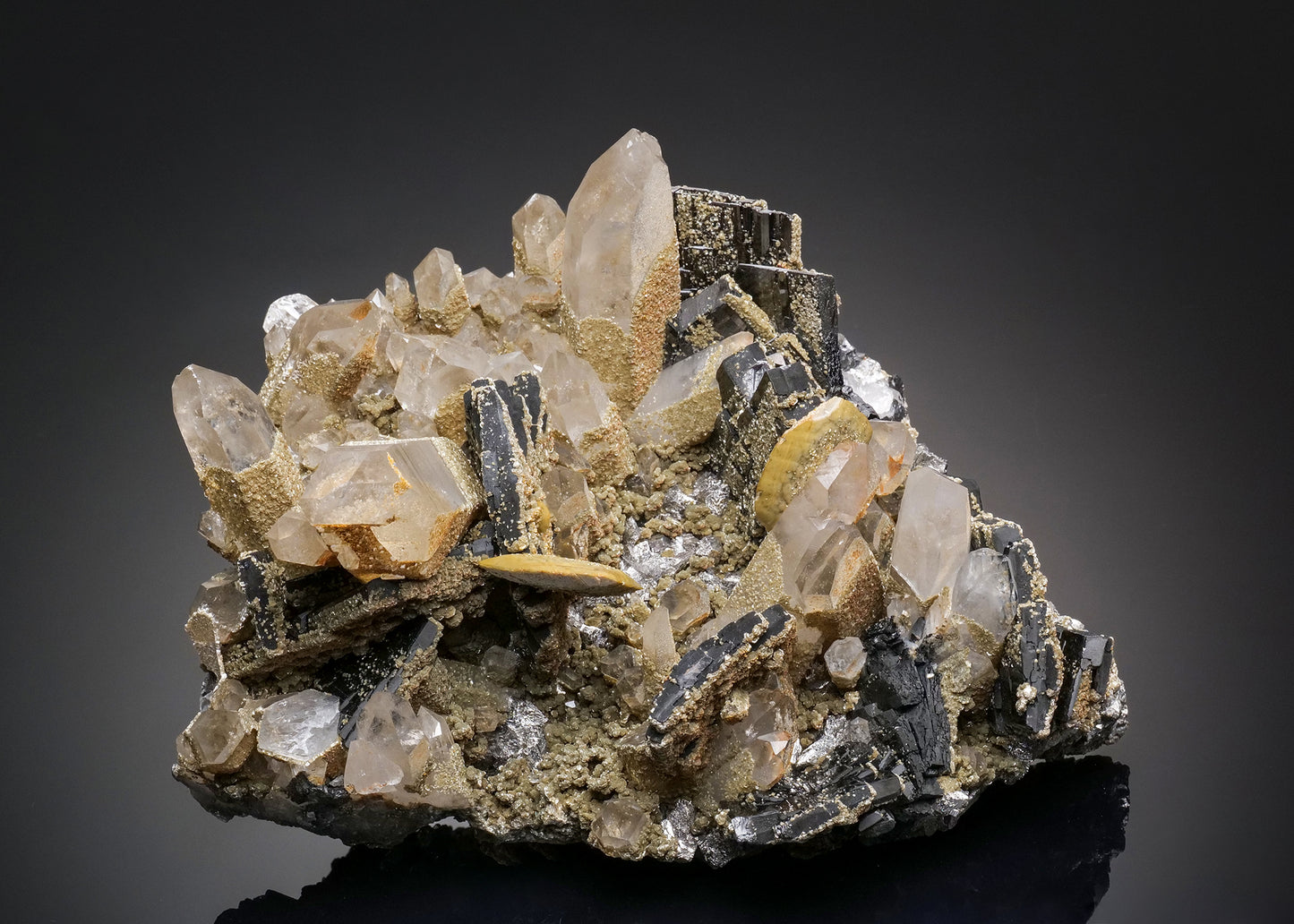 FERBERITE with SIDERITE, MUSCOVITE, ARSENOPYRITE, FLUORAPATITE and QUARTZ