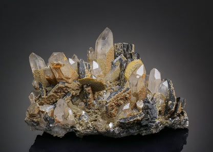 FERBERITE with SIDERITE, MUSCOVITE, ARSENOPYRITE, FLUORAPATITE and QUARTZ